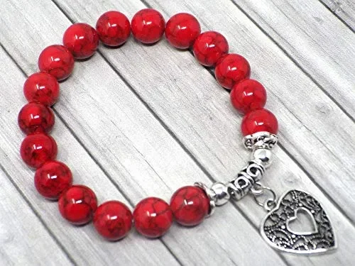 Bracciale da donna in perle di turchese rosso con pendente argento…